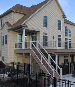 home with deck and vinyl railing
