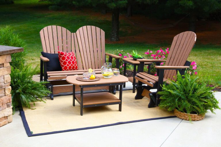 Glider poly furniture surrounded by plants.
